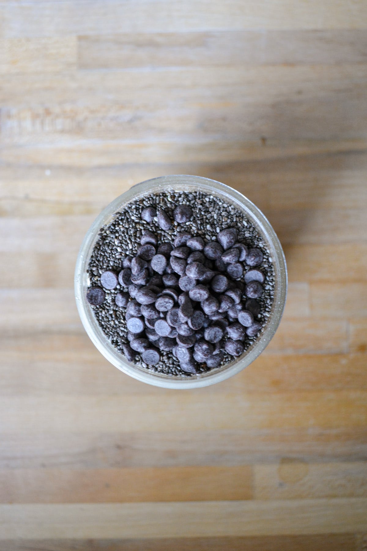 Chia seeds and mini chocolate chips in a jar.