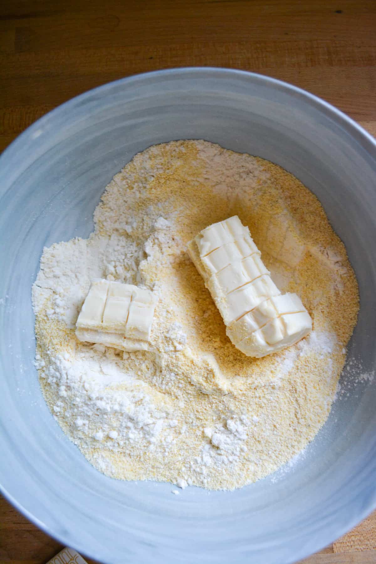 Dry ingredients and cubed butter in a large mixing bowl.
