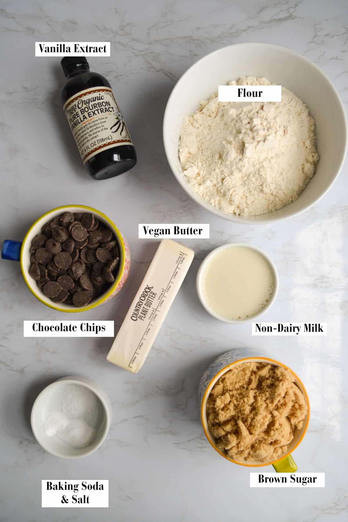 Ingredients needed to make this recipe in small bowls on a marble surface.