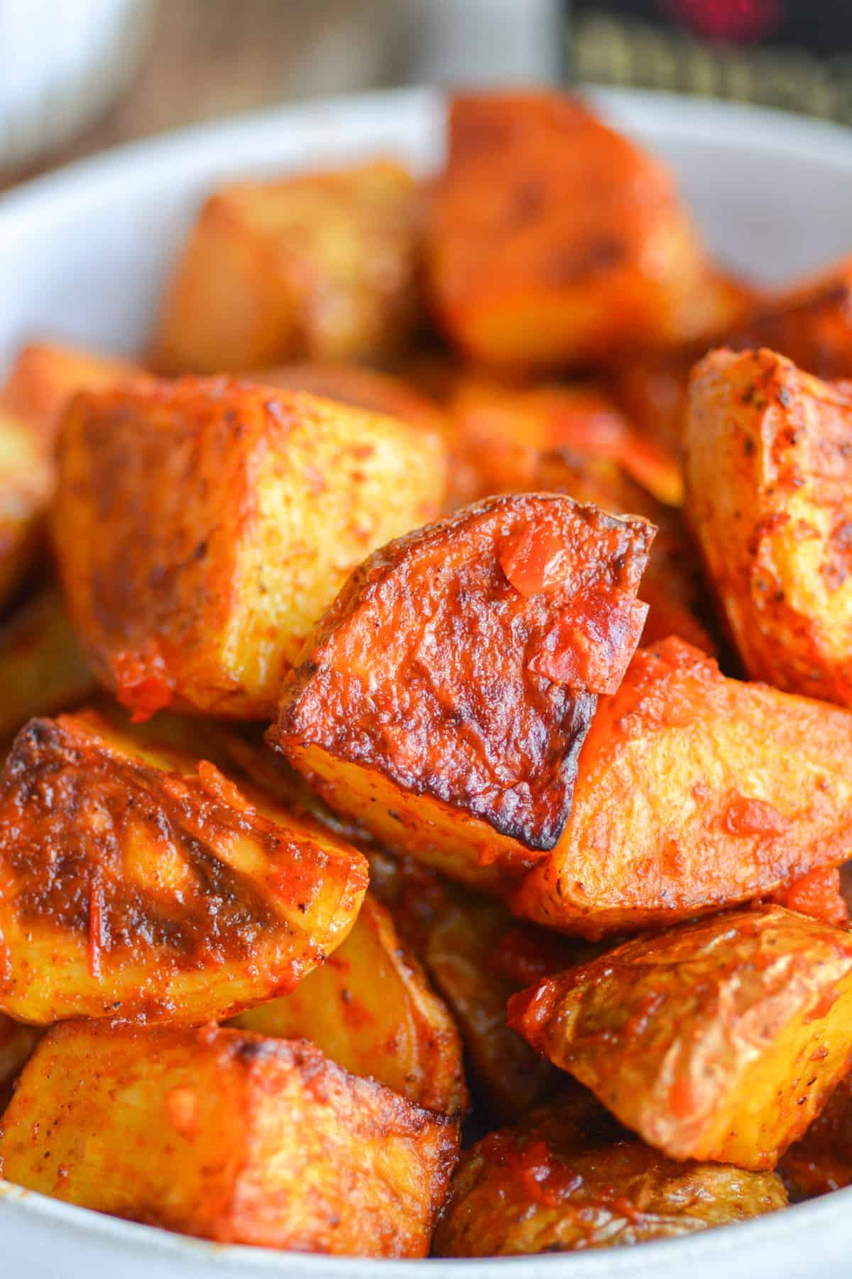 Vegan Spicy Harissa Roasted Potatoes piled into a dish.