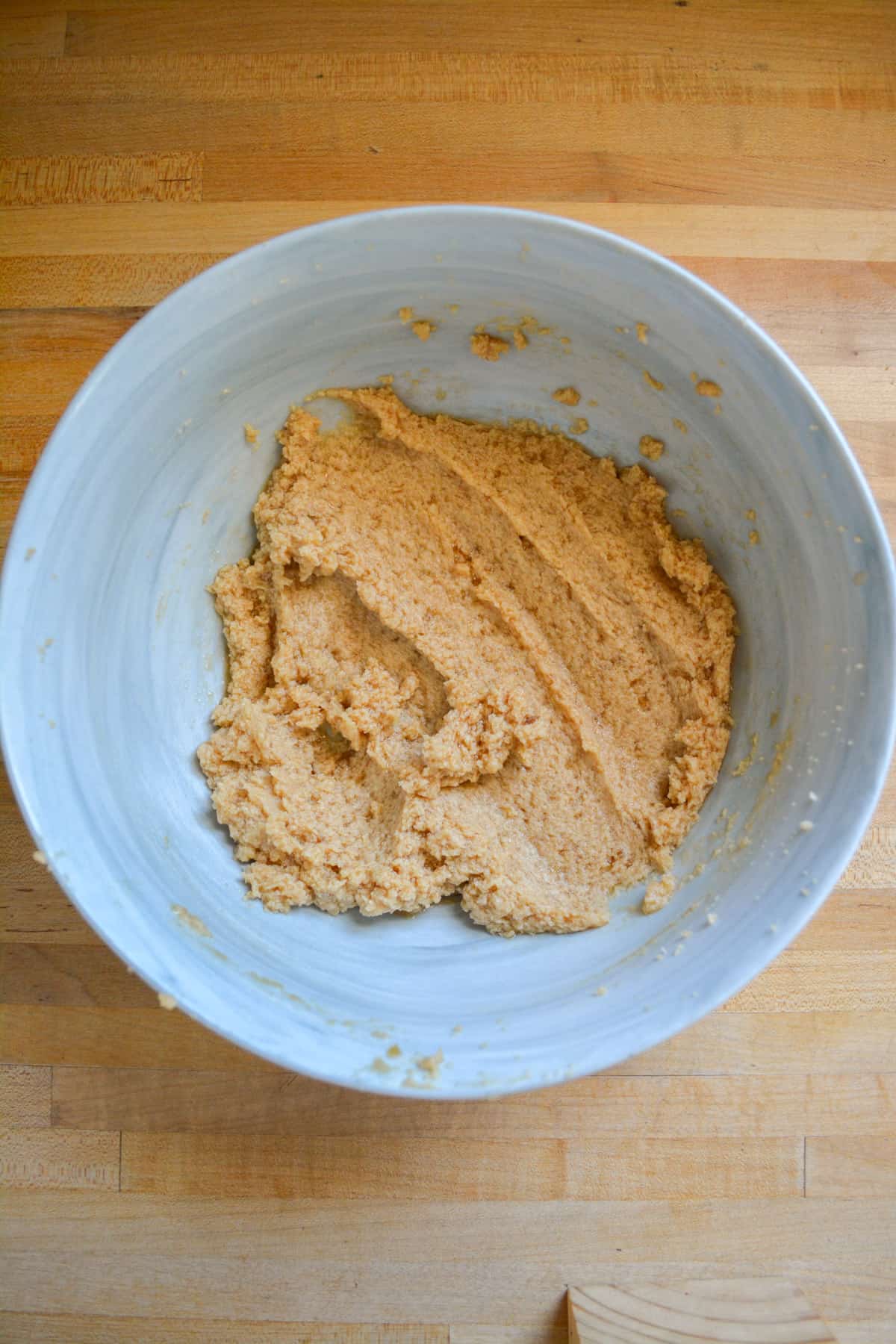 Vegan butter and brown sugar creamed together in a bowl.