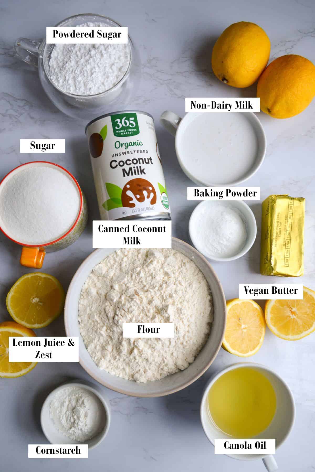 Ingredients needed for this recipe in small cups and bowls on a marble board.
