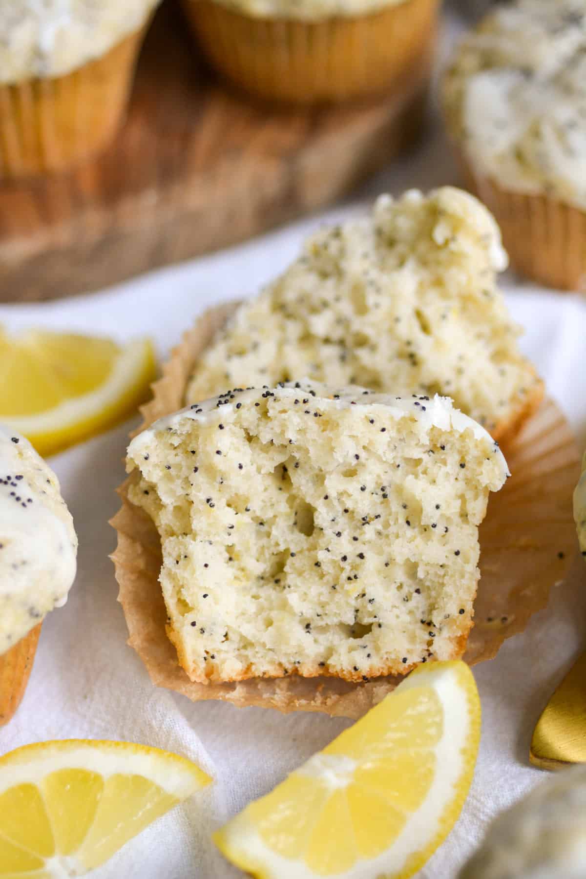 Vegan Lemon Poppyseed Muffin cut in half to show the texture of the inside.