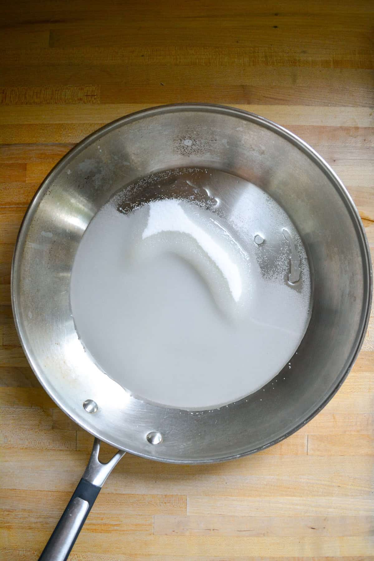 Sugar and water in a large skillet.