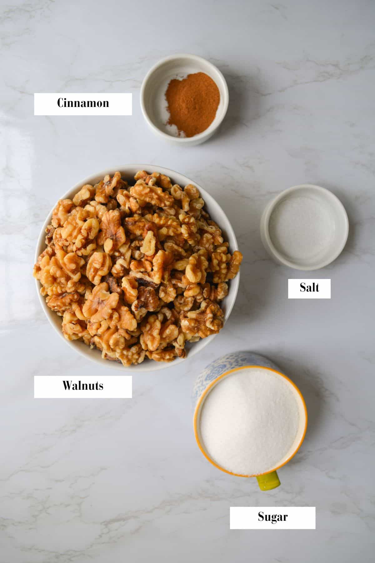 Ingredients for making this recipe in bowls on a marble board.