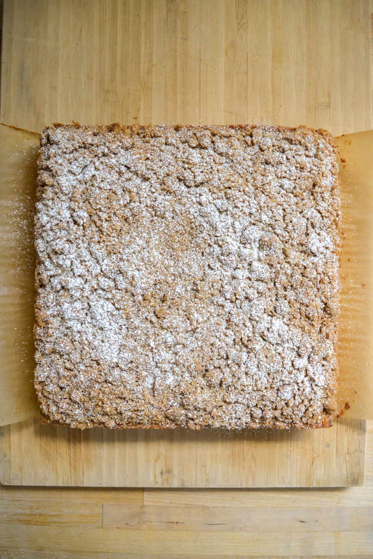 Baked Vegan Coffee Cake topped with powdered sugar.