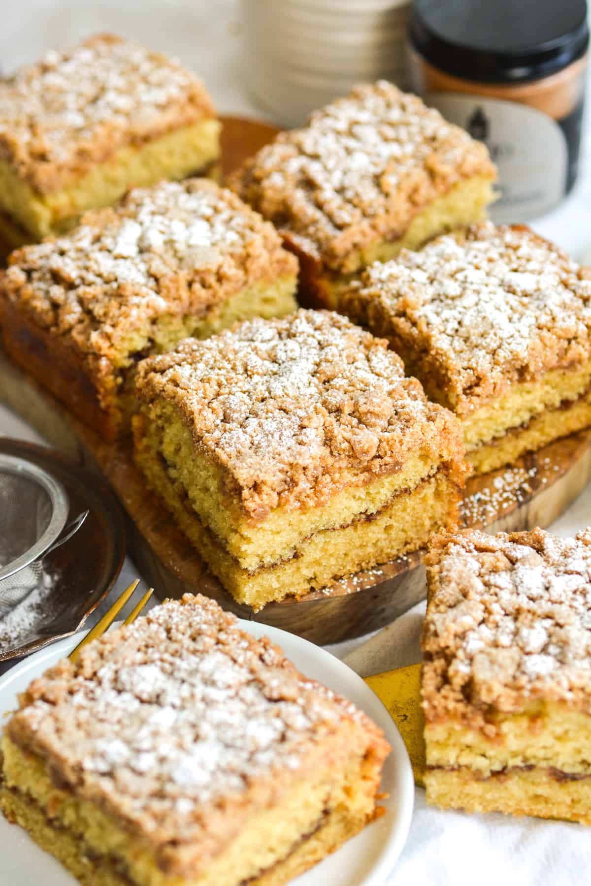 Vegan Coffee Cake squares on a wooden cutting board.