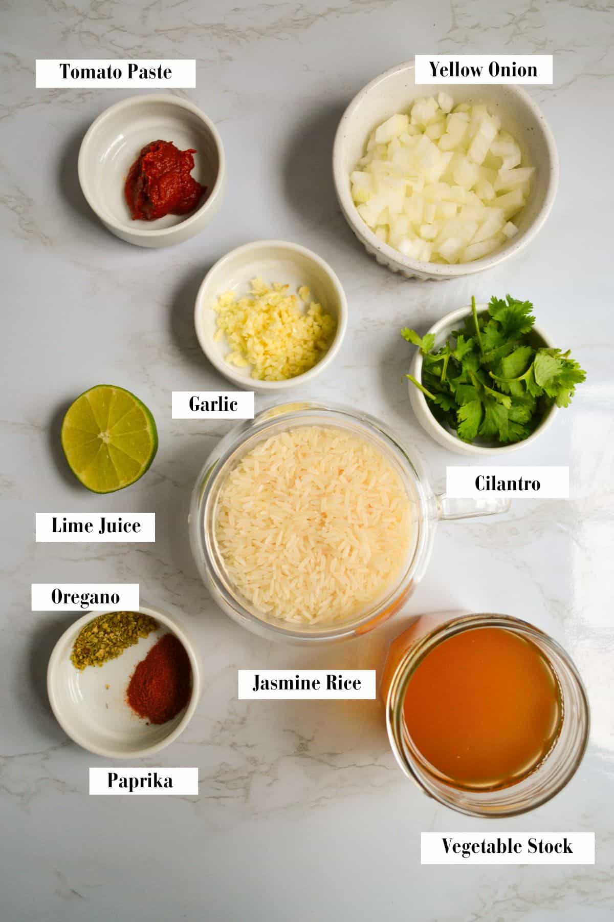 Ingredients for making this recipe in small containers on a marble surface.
