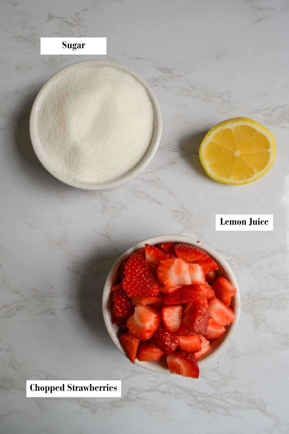 Ingredients to make this recipe in small bowls on a marble surface.