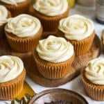 Vegan Earl Grey Cupcakes on a small wooden board.