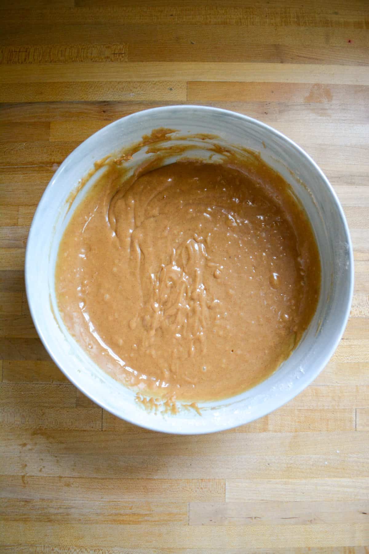 Cupcake batter in a large marble bowl.