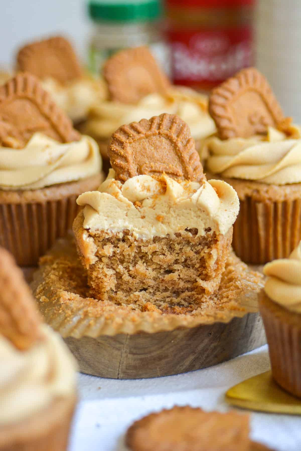 A bite taken out of a Biscoff Cupcake.