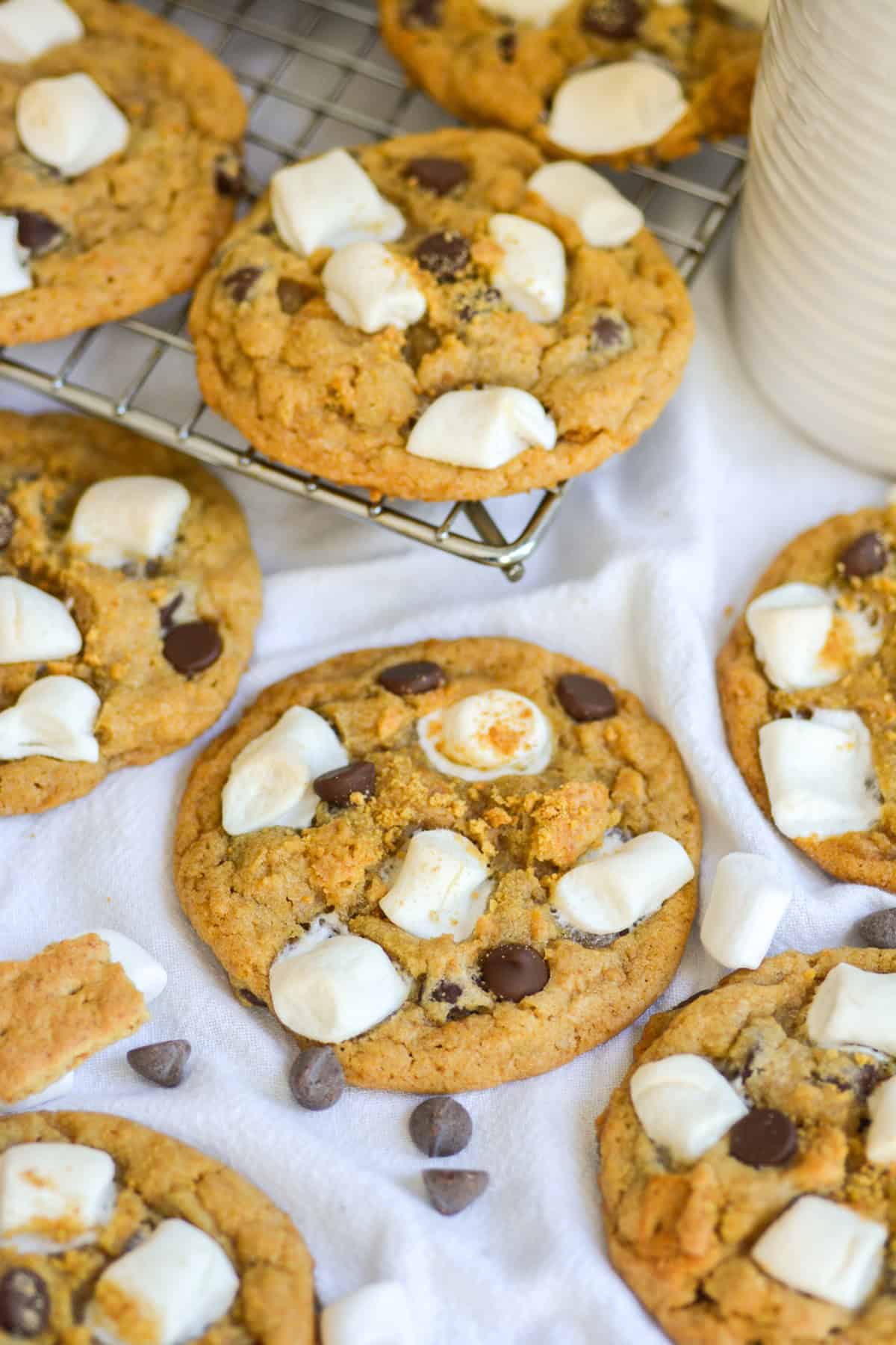 Vegan Smores Cookies on a linen cloth with cookies on a wire rack in the background.