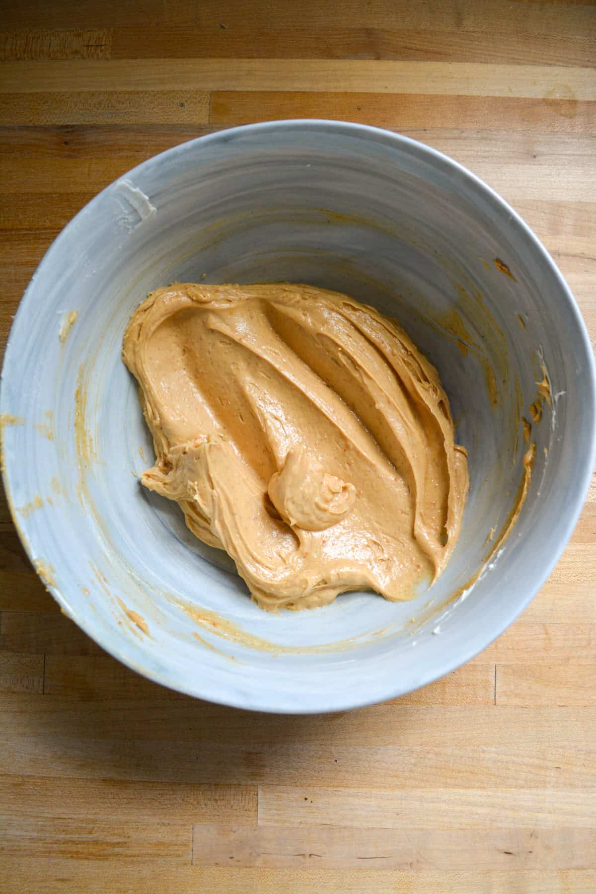 Peanut butter and vegan butter mixed together until smooth in a large mixing bowl.