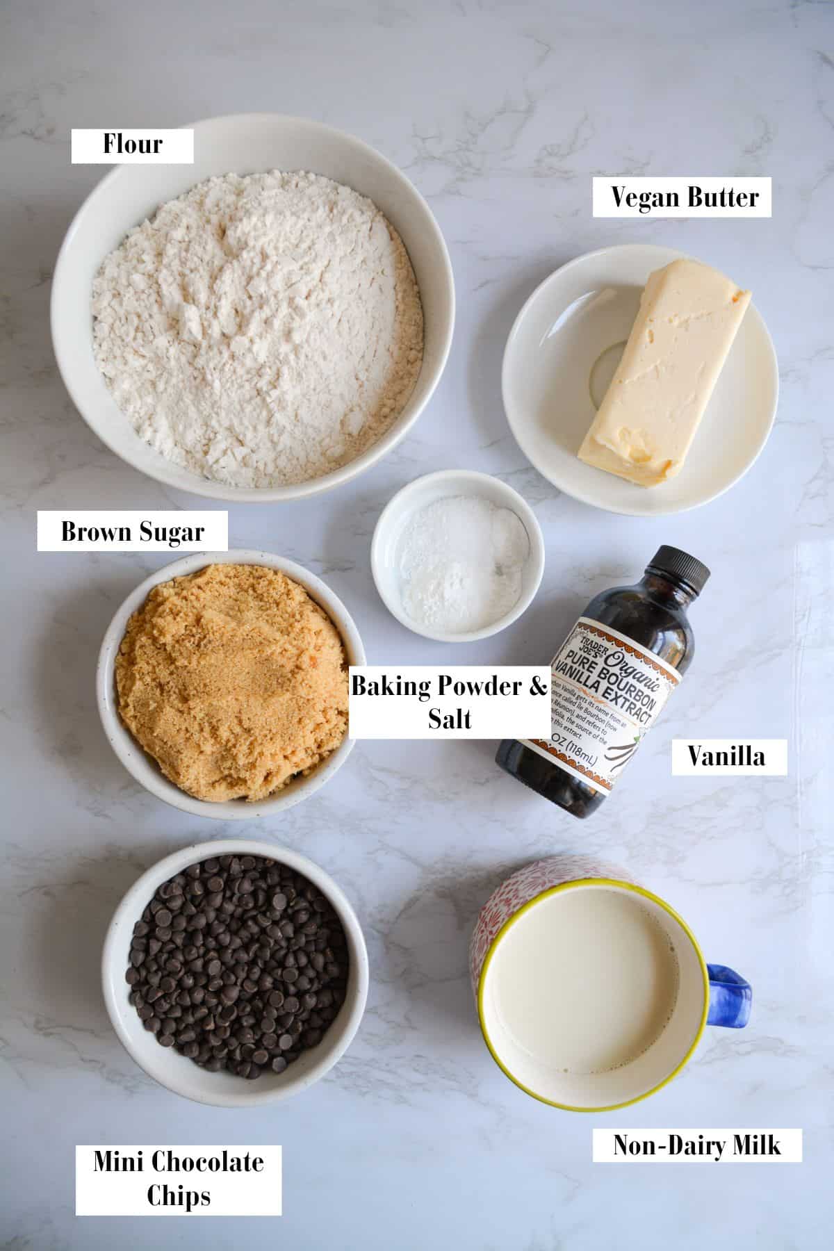 Ingredients for making this recipe in small bowls on a marble surface.