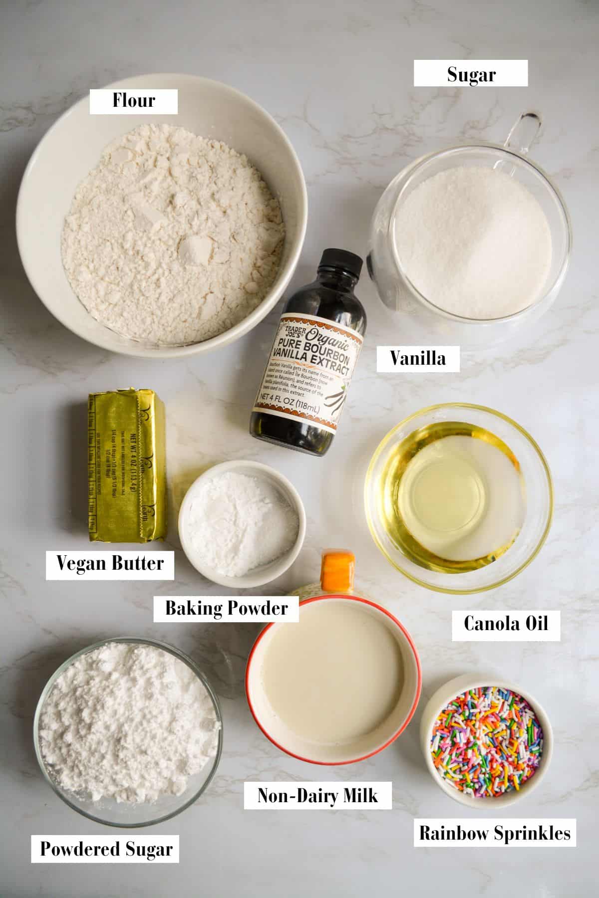 Ingredients for making this recipe in small bowls on a marble surface.