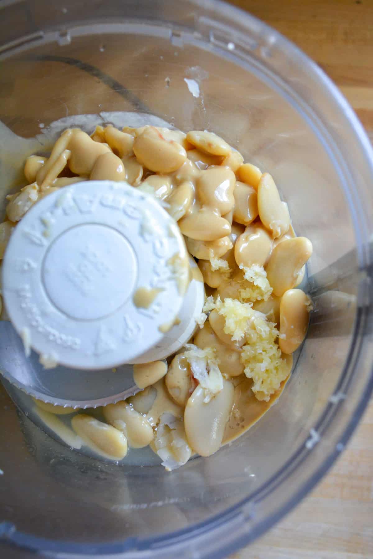 Butter beans, tahini, lemon juice, olive oil and garlic in a food processor.