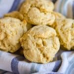 Olive Oil Drop Biscuits in on a striped cloth napkin.