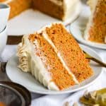 A slice of vegan carrot cake on a small plate.