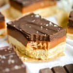 Vegan Millionaires Shortbread with a bite taken out of it.