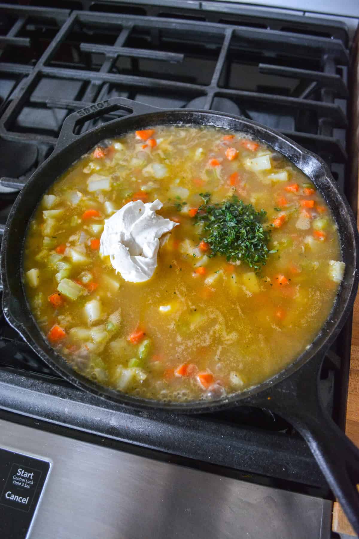 Vegetable stick, cream cheese and herbs added into the pan with the vegetables.