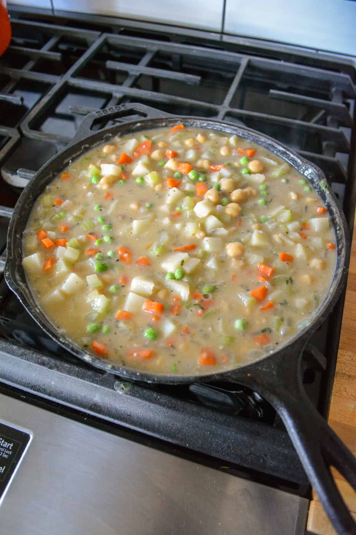 Chickpeas and frozen peas added into the vegan pot pie filling.