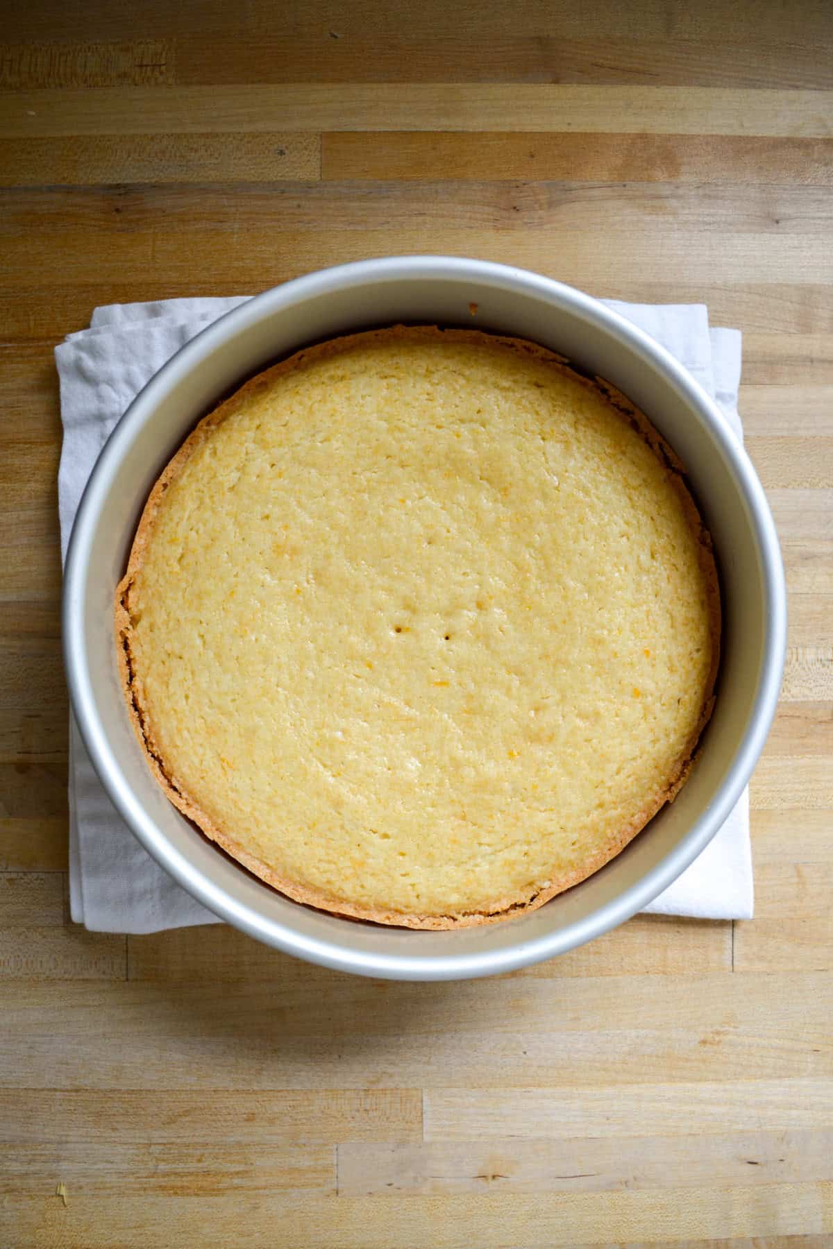 Baked cake in a round pan.
