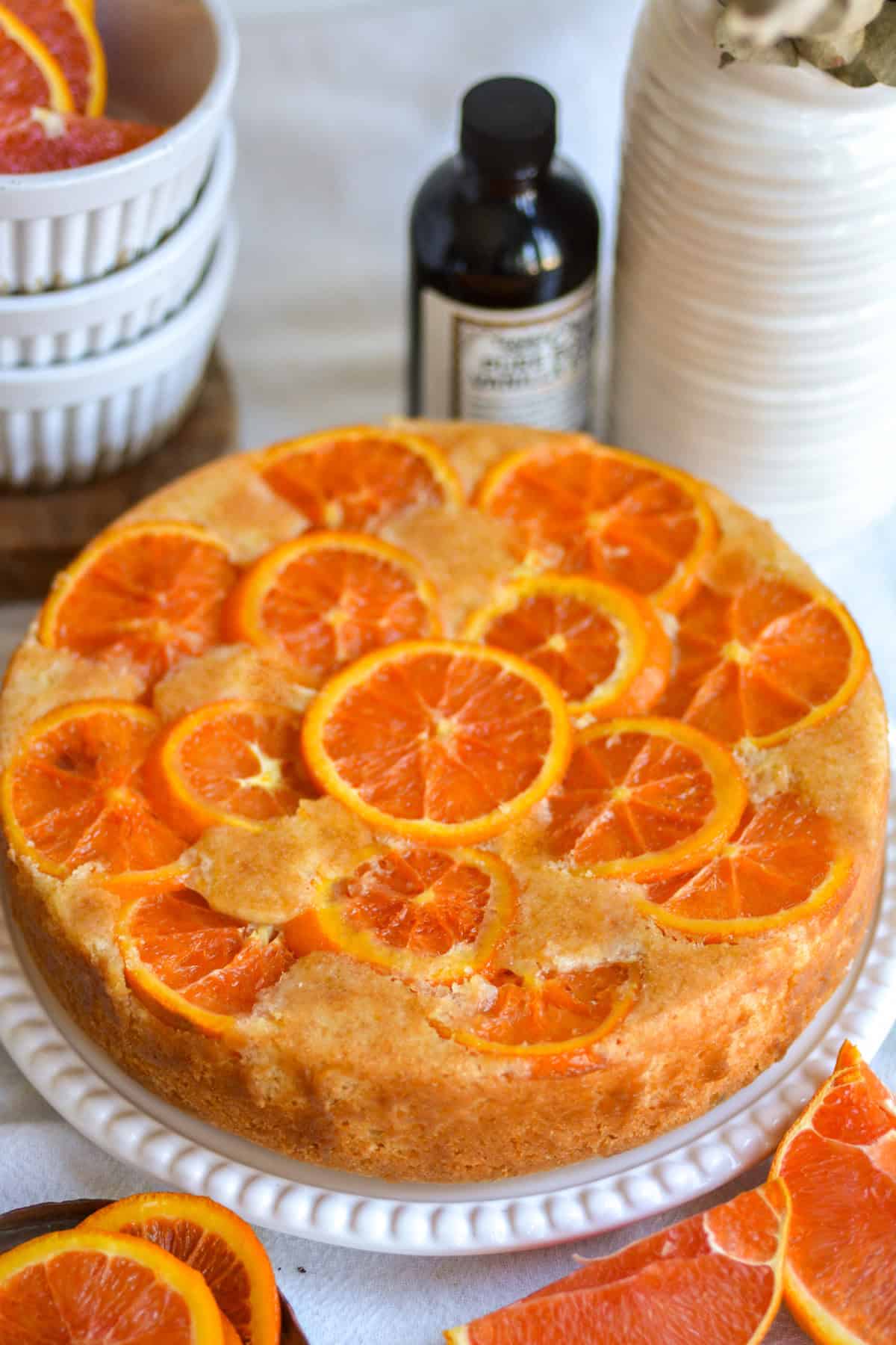 Orange Upside Down Cake flipped onto a cake plate.