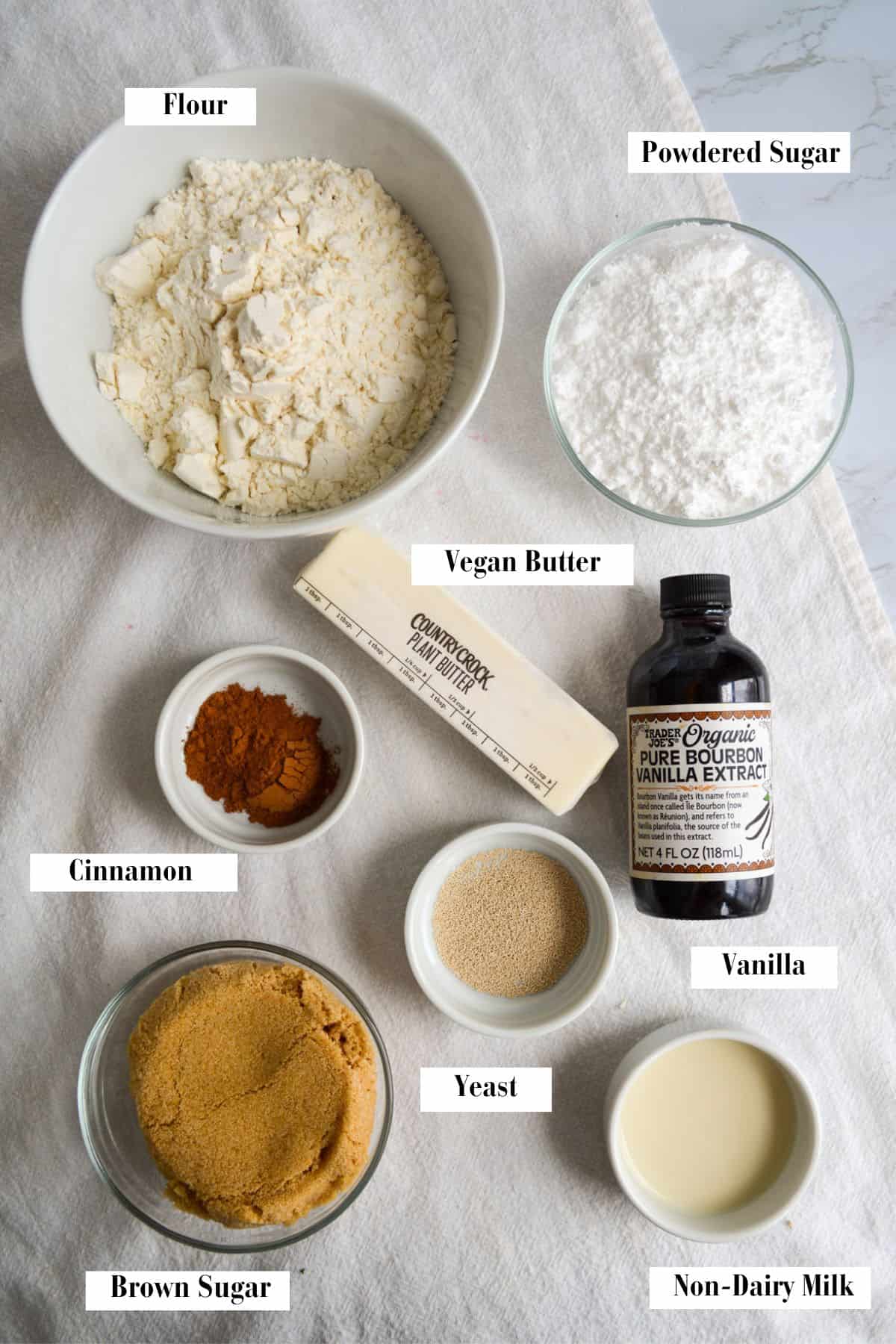 Ingredients for this recipe in small bowls on a linen cloth.