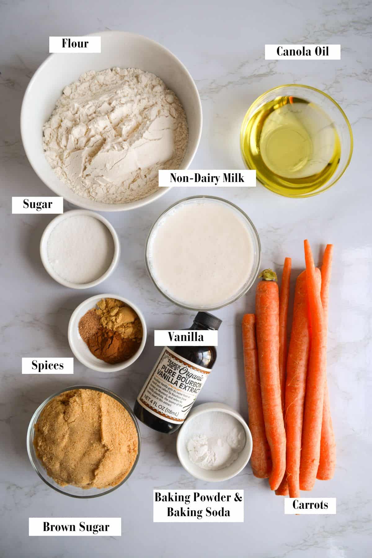 Ingredients for this recipe in small bowls on a marble surface.