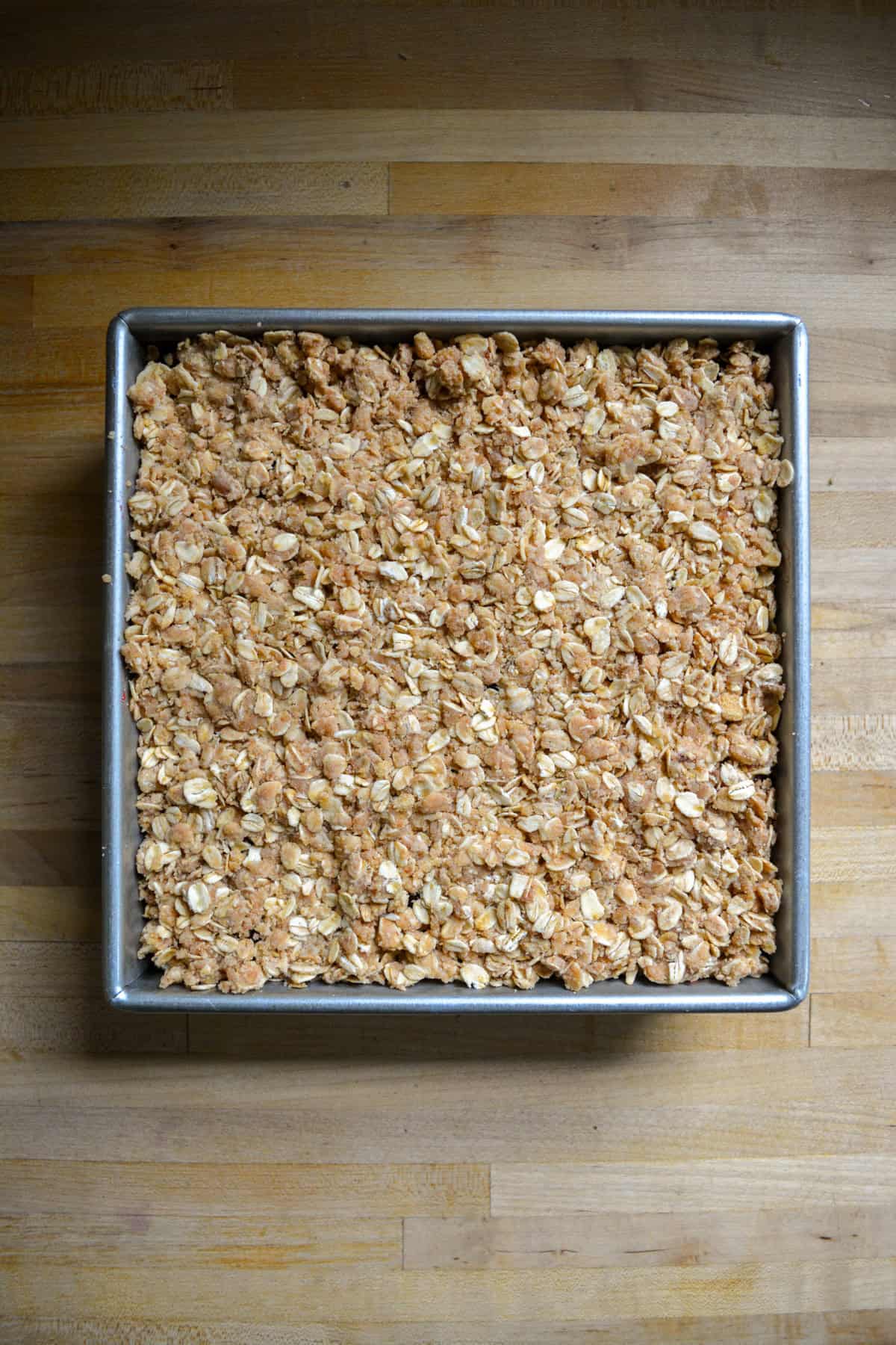 Ingredients in an 8 by 8 inch square pan ready to bake.