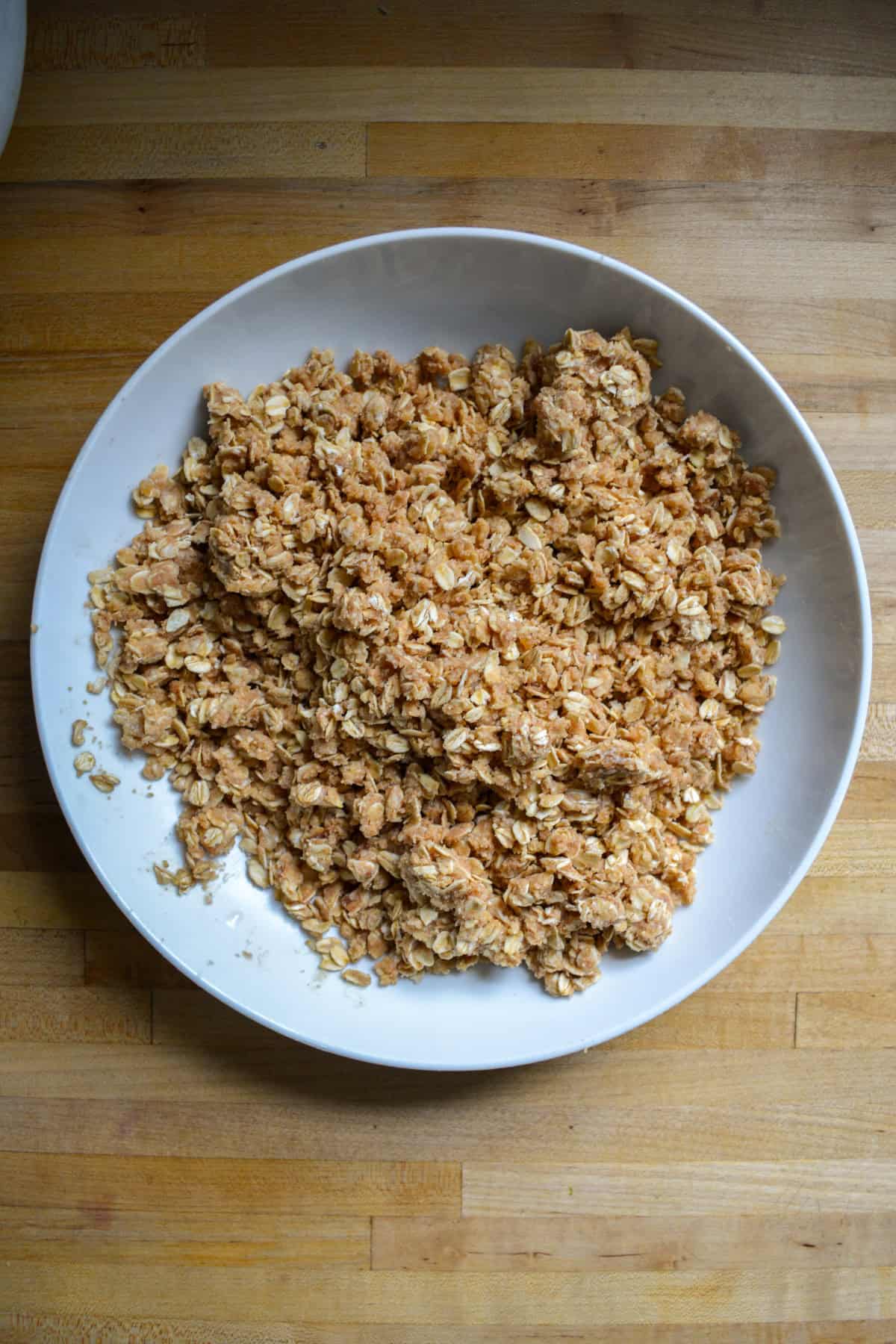 Oat crumble topping in a large bowl.