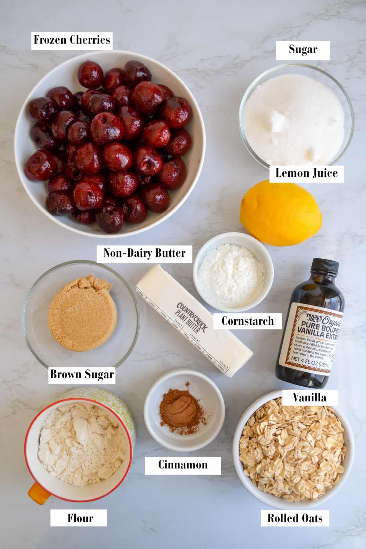 Ingredients for this recipe in small bowls on a marble surface.