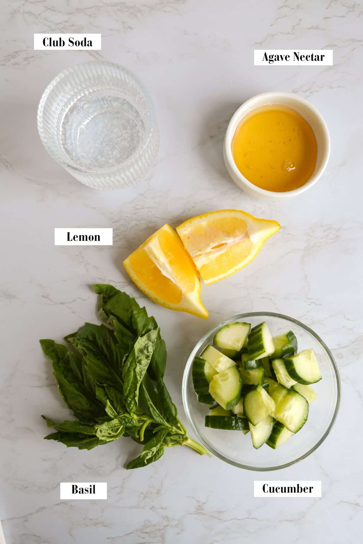 Ingredients for this recipe in small bowls on a marble surface.