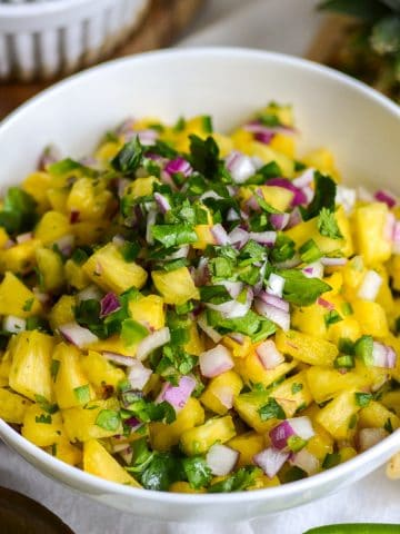 Pineapple Pico de Gallo salsa in a white bowl.