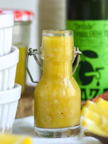 Lemon Shallot Vinaigrette in a small glass jar.