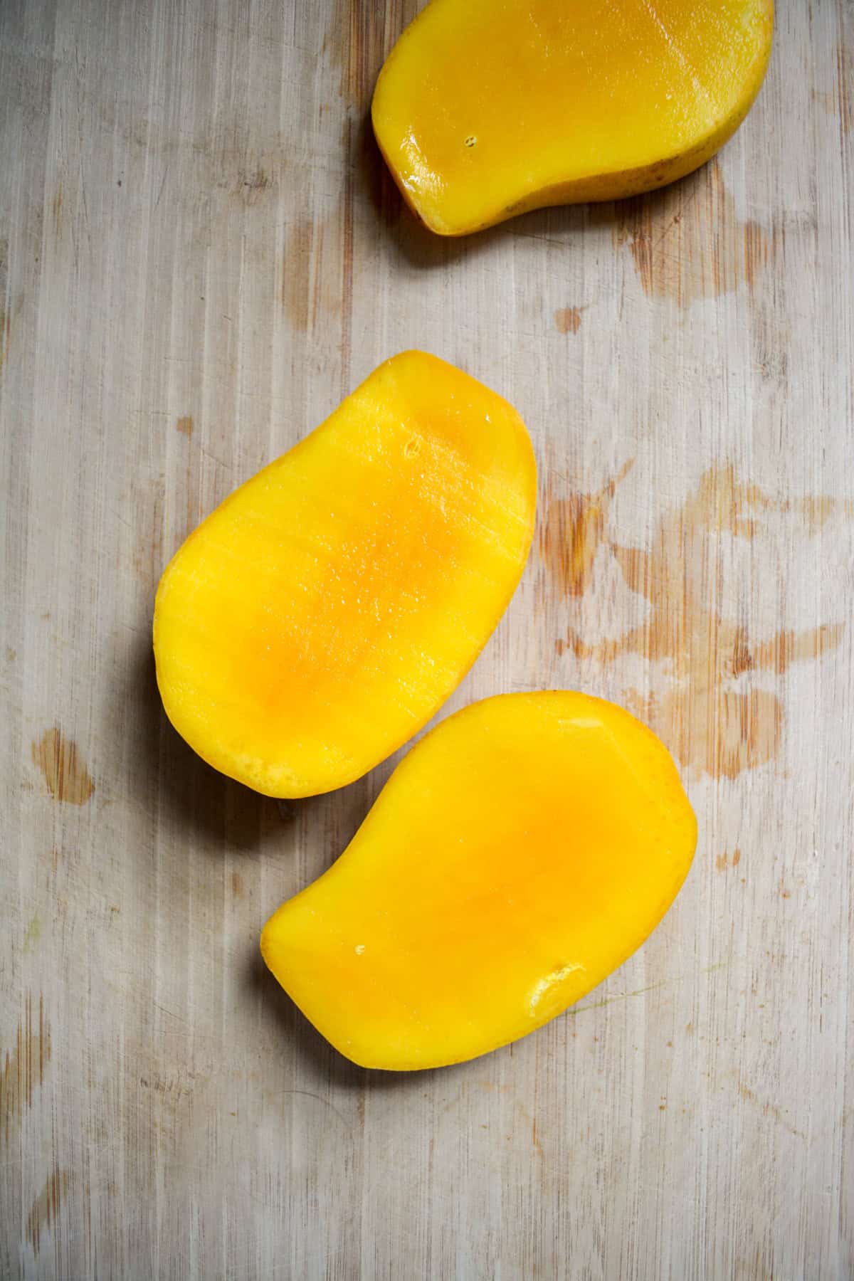 Mango cheeks cut away from the pit.