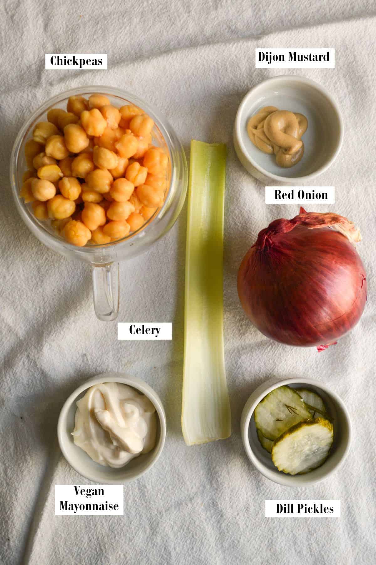 Ingredients for making this recipe in small bowls on a linen cloth.