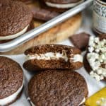 Chocolate Whoopie Pie filled with vegan cream cheese frosting with a bite taken out of it.