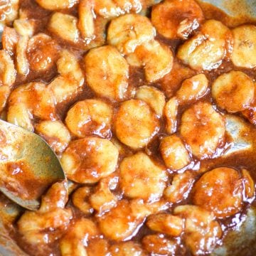 Caramelized Banana slices in a skillet.