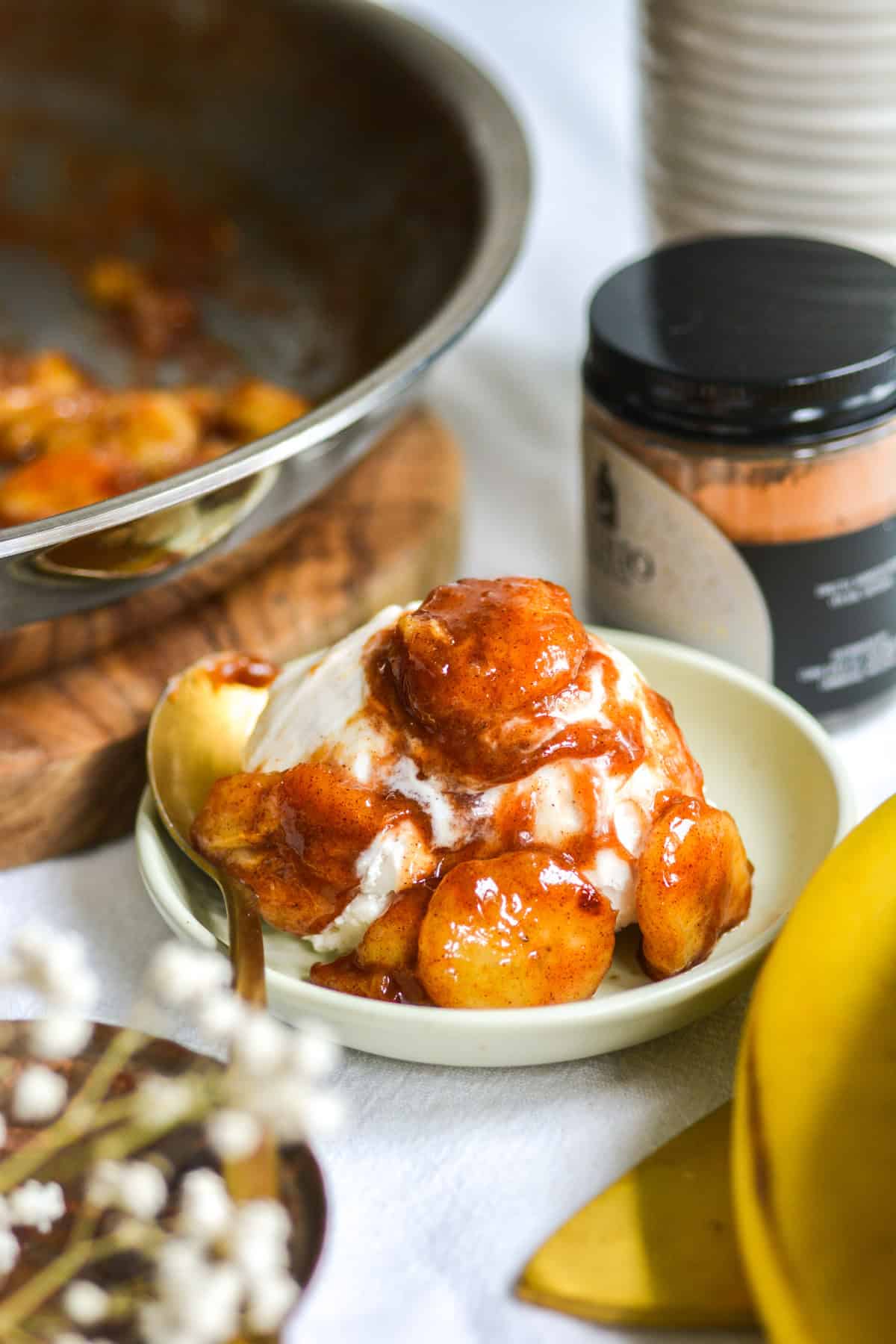 Caramelized Bananas on a scoop of vanilla ice cream.