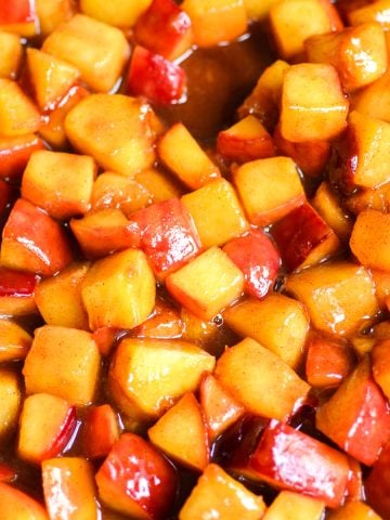 Chopped Caramelized Peaches in a skillet.