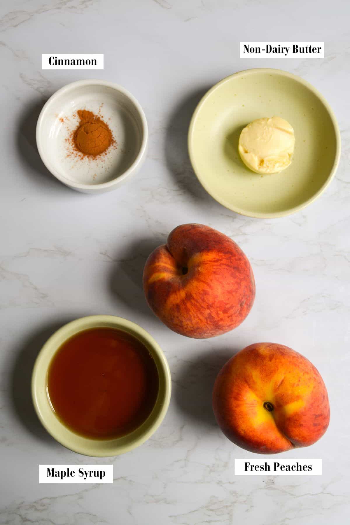 Ingredients for making this recipe in small bowls on a marble surface.