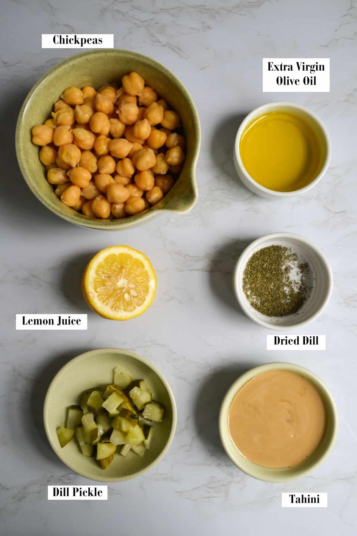 Ingredients for making this recipe in small bowls on a marble surface.