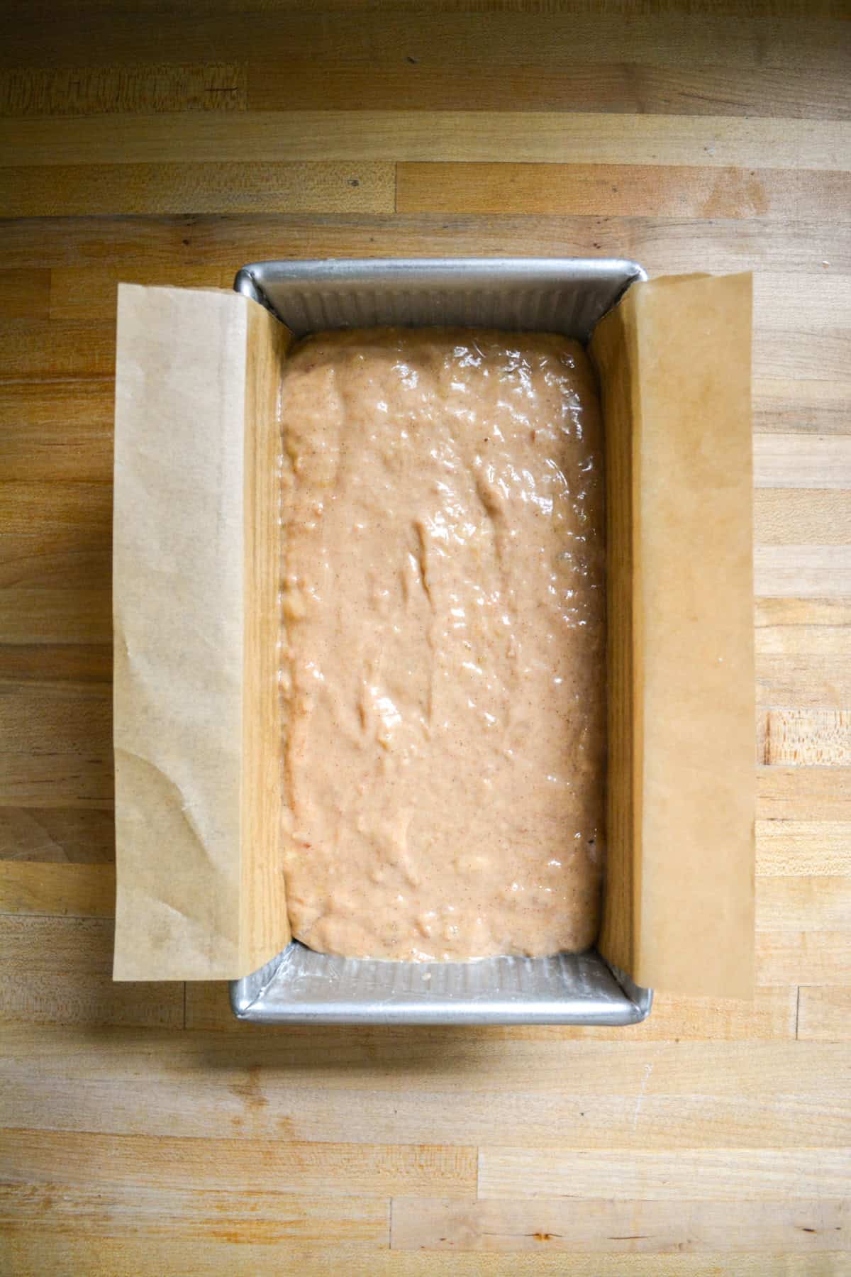 Batter in a prepared loaf pan.