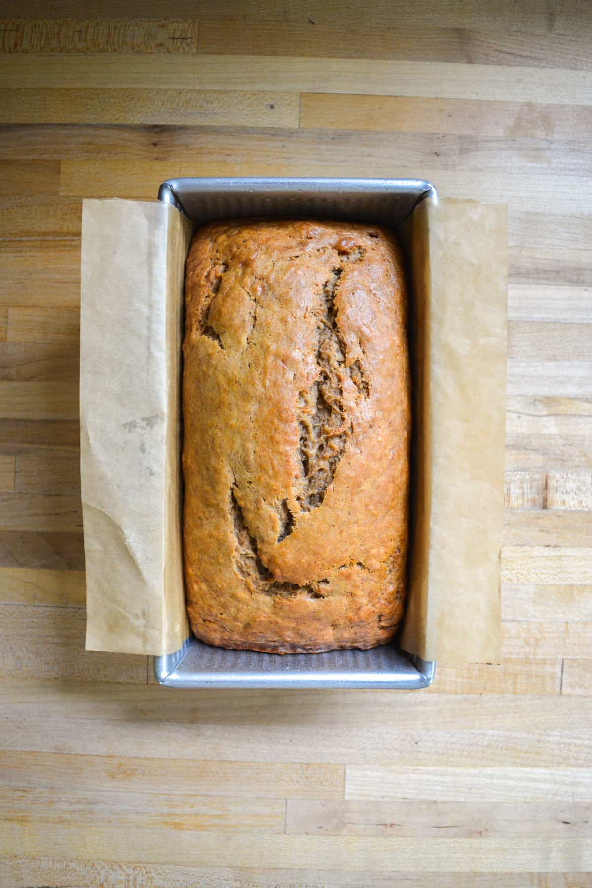 Baked vegan banana bread in a loaf pan.