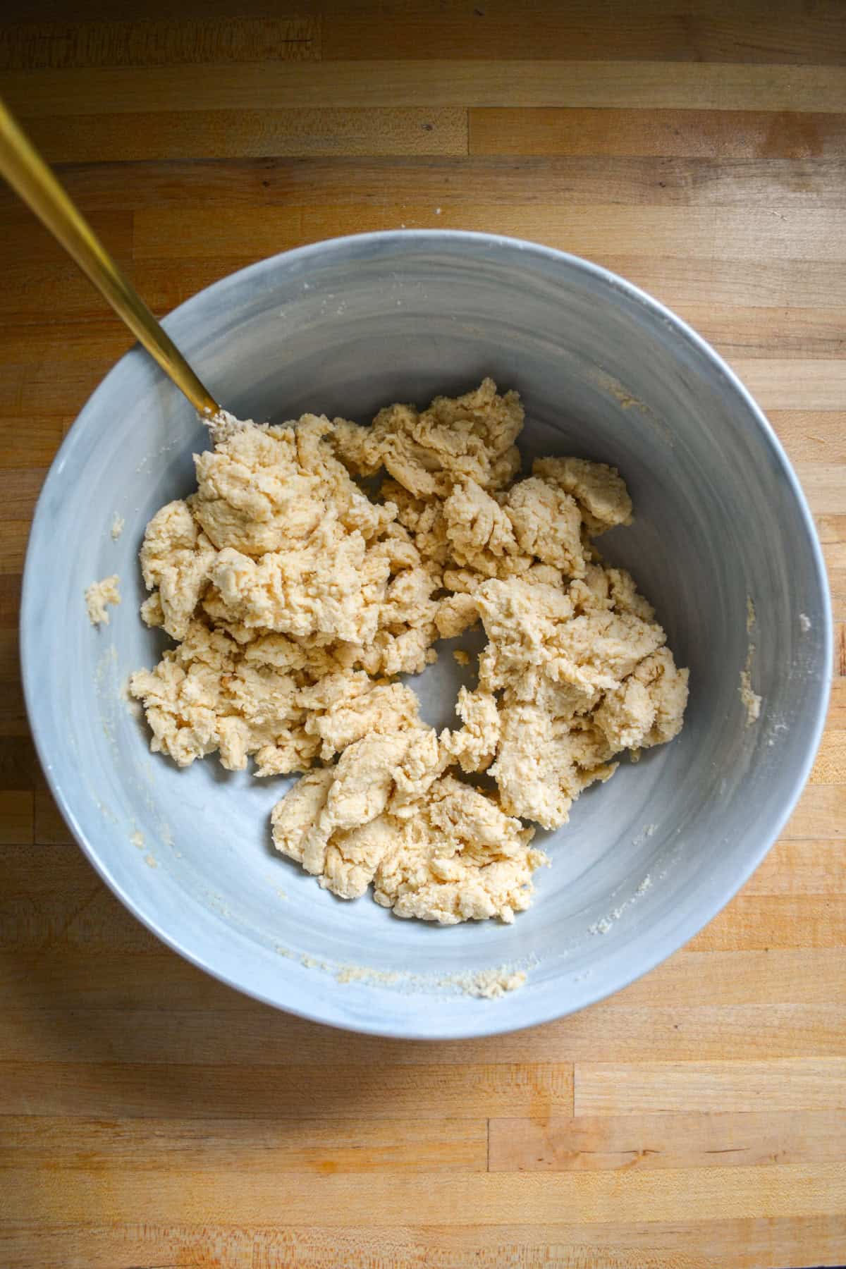 Biscuit topping in a large mixing bowl.