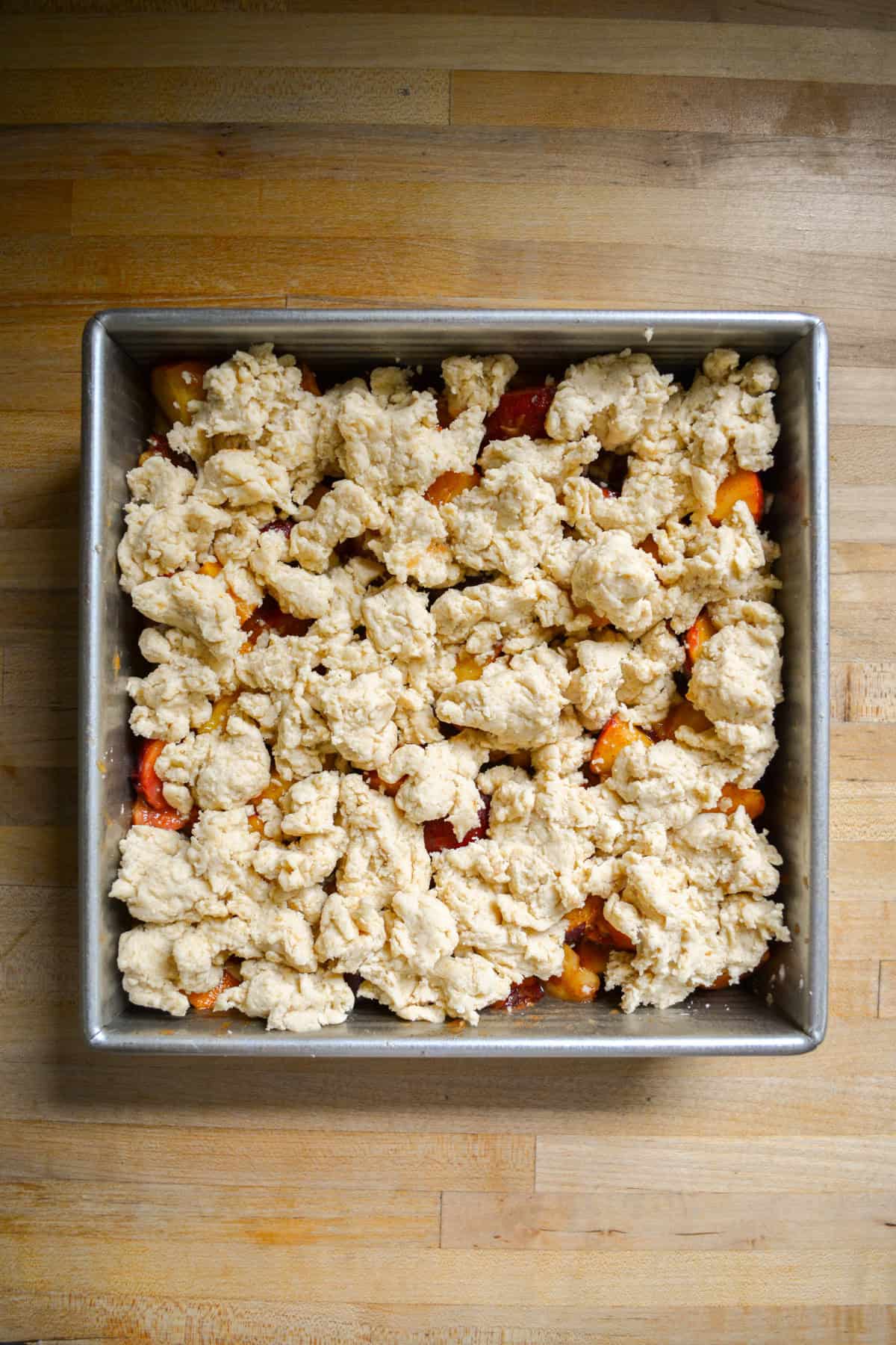 Vegan Peach Cobbler ready to be baked.