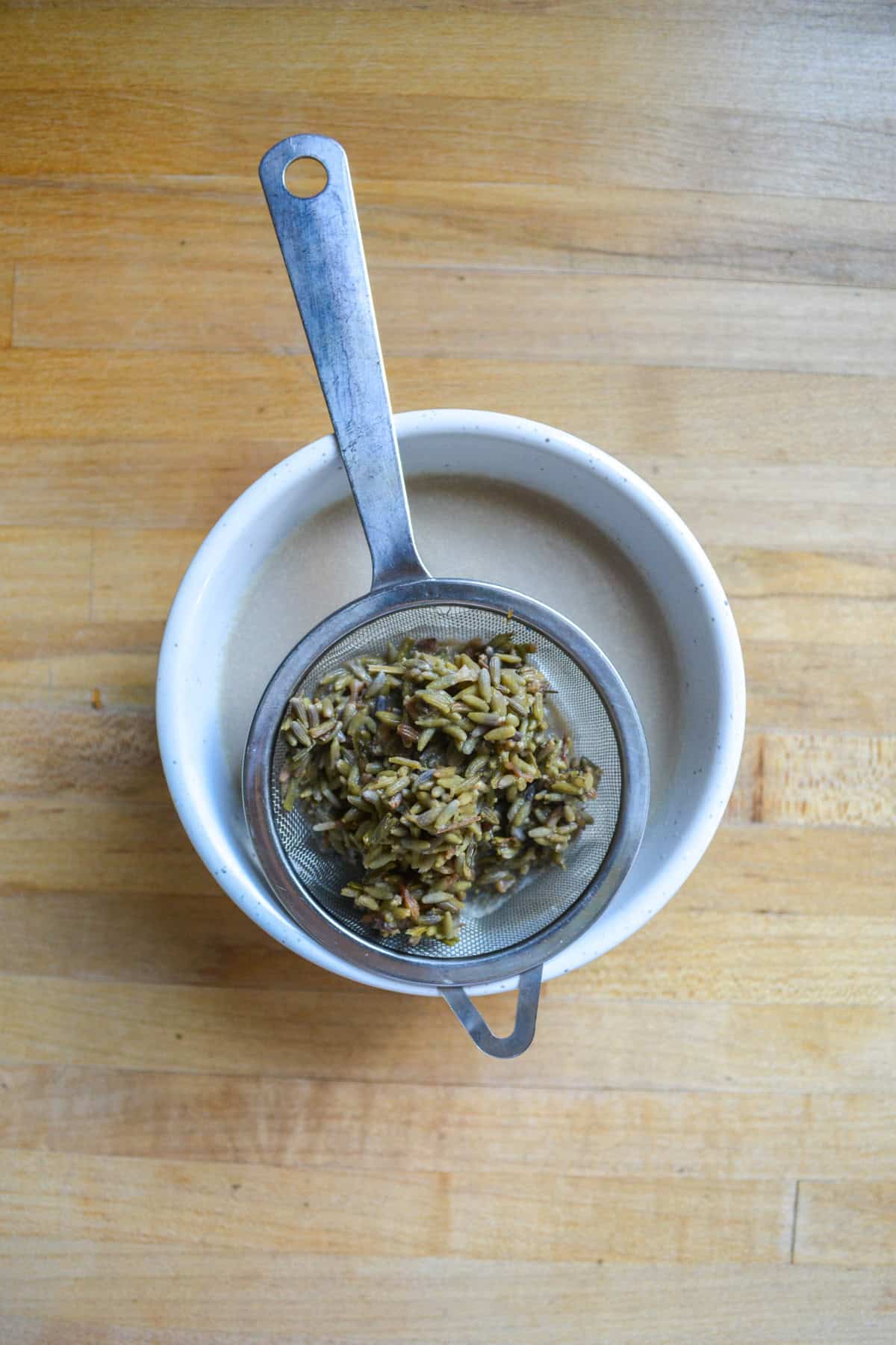 Lavender flowers strained out of the milk.