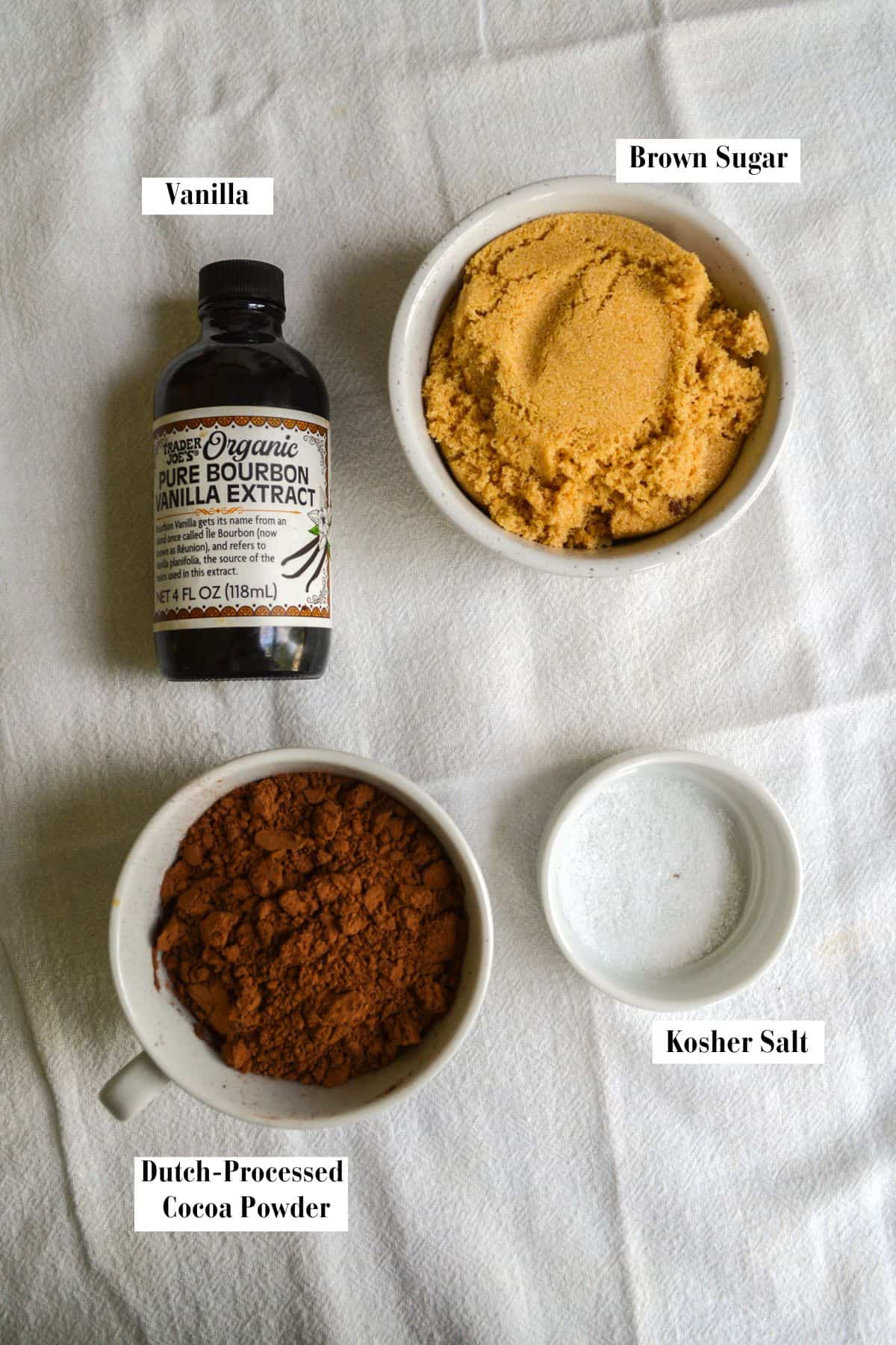 Ingredients for this recipe in small bowls on a linen cloth.